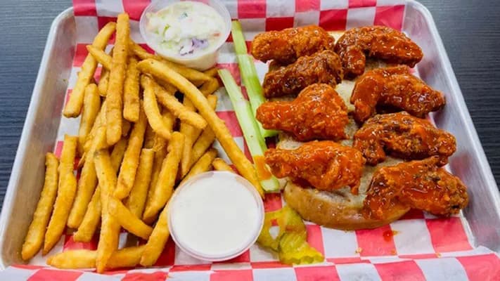 Buffalo chicken wings with fries, celery and ranch
